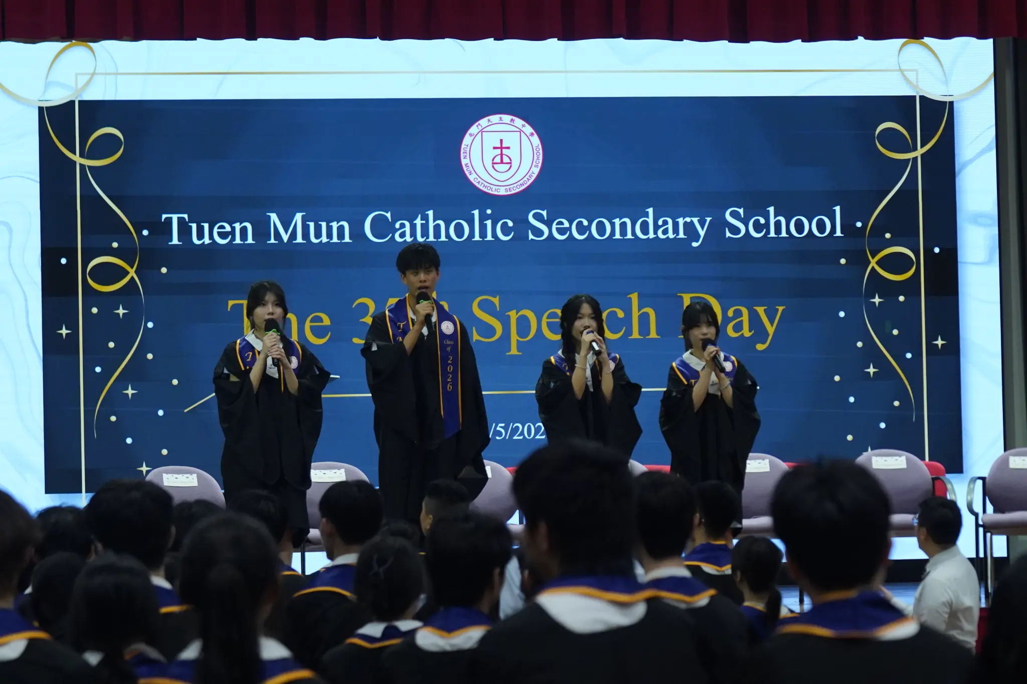 Students presenting on stage at Speech Day